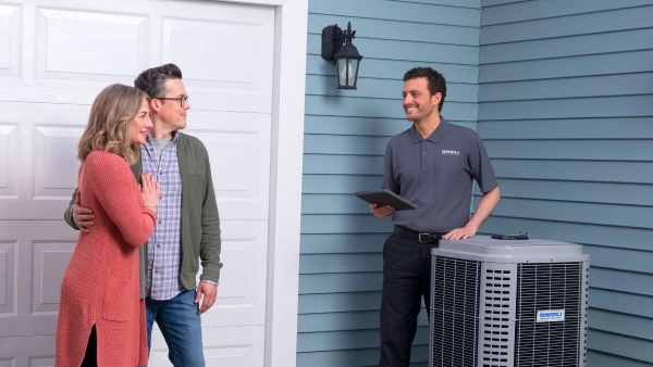 hvac tech talking with couple